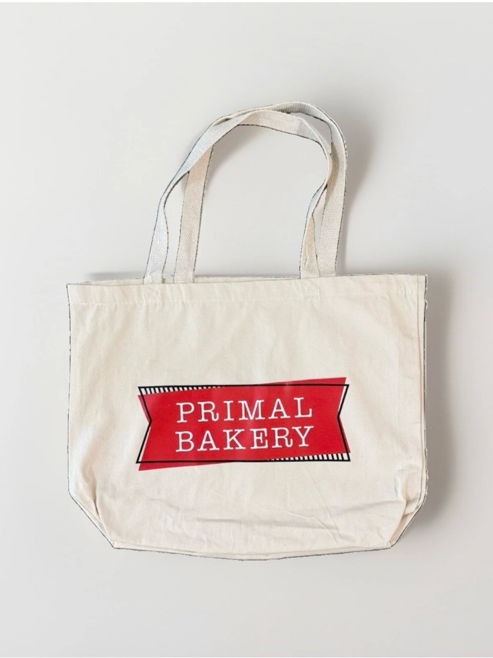 PRIMAL BAKERY Cream Canvas Tote Bag with Red Logo
